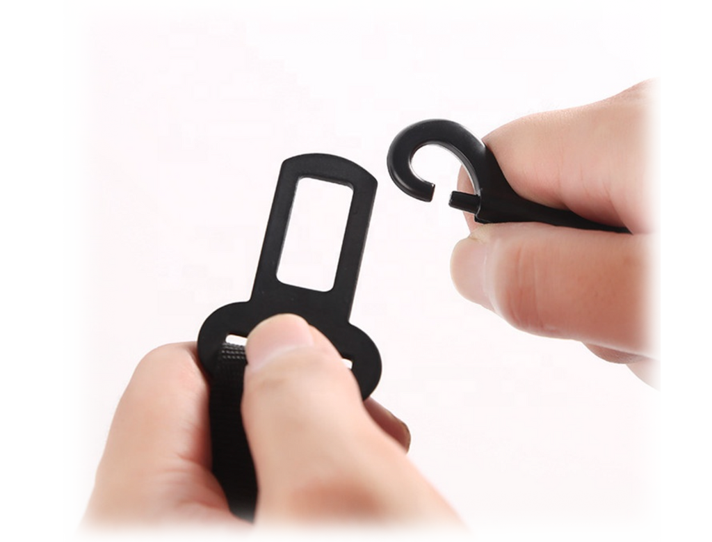 close up of black buckle and clip for dog seatbelt
